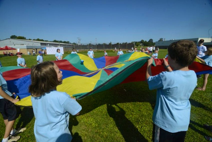 Kids participate in a parachute activity Tuesday during the Jumpstart Games in Charlottetown.