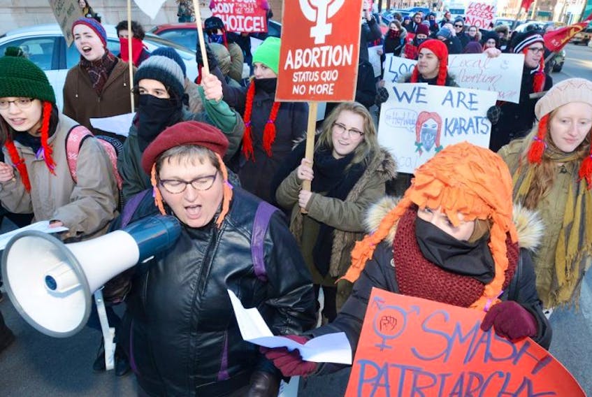 Dr. Colleen MacQuarrie, holding bullhorn, takes part in a demonstration in Charlottetown demanding access to abortion in P.E.I. in this March 8 Guardian file photo. Reproductive Justice New Brunswick is to launch its campaign Thursday in Fredericton with a public lecture by MacQuarrie.