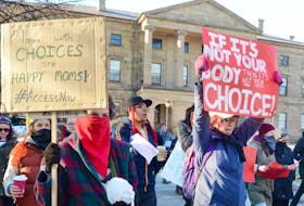 ["A coalition of pro-choice groups marched through the streets of Charlottetown earlier this year during International Women's Day to protest the lack of abortion services on the Island."]