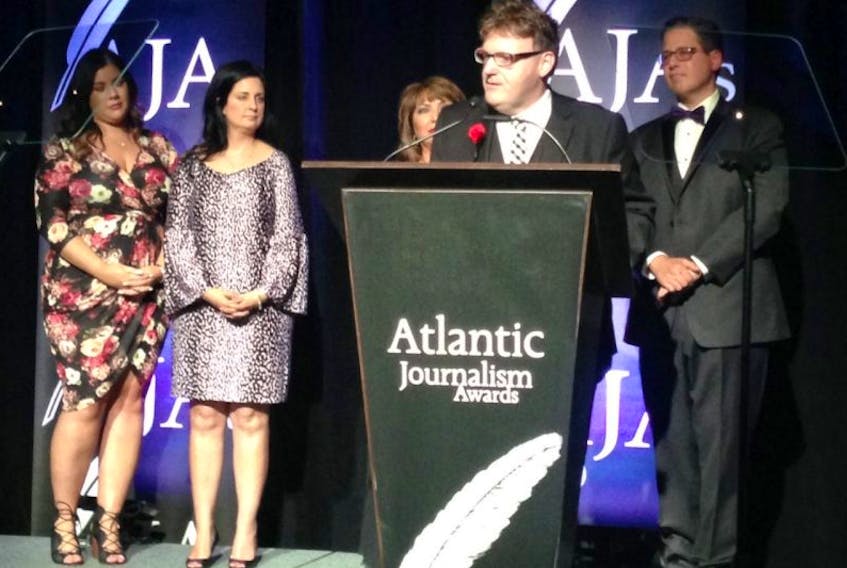 The Guardian managing editor Wayne Thibodeau accepts the newsroom's Atlantic Journalism Award for Breaking/Spot News Reporting: Print and Online Category during the awards show Saturday night at St. John's Convention Centre in Newfoundland and Labrador.