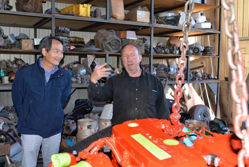 Gavin Quinn, owner of Quinn’s Marine & Machine Shop in Cardigan, explains the business to Dinh Nhu Nguyen, one of the newcomers on the P.E.I. Connectors tour. After 37 years, Quinn is looking to retire from the business.