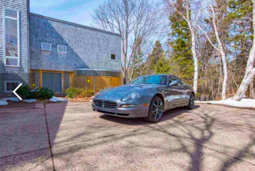 A listing on Kelly Lantz’s Century 21 website features a home at 20 Battery Point Rd. in Stratford. In a unique twist, the price of the listing also includes the Maserati pictured in the driveway. 