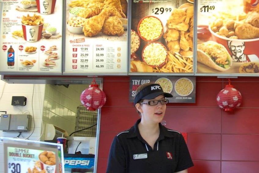 Heather Barry serves a meal at Kentucky Fried Chicken (KFC) on University Avenue in Charlottetown. All five KFCs on Prince Edward Island have been sold to Franchise Management Inc. (FMI), one of the largest Pizza Hut, KFC and Taco Bell franchise operators in North America.