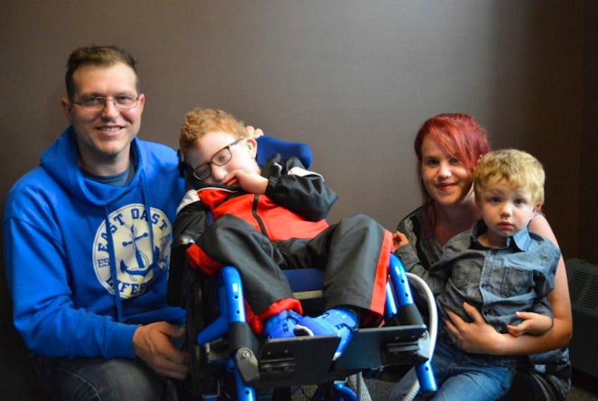 A fundraising golf tournament is being held Sunday, Sept. 17 at Glen Afton Golf Course to help the McConnell family of Georgetown afford a bigger vehicle to drive their  son, Dexter, second from left, back and forth to the IWK in Halifax. Pictured are Dexter’s parents, Justin, left, Amy, and their other son, Jaxon.