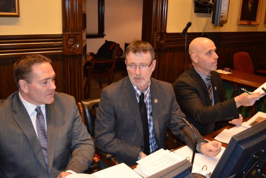 Charlottetown councillors, from left, Bob Doiron, Terry MacLeod and Greg Rivard are pictured prior to Monday’s regular public monthly meeting of council. At the meeting, Rivard presented two resolutions that could lead to more crematoriums in Charlottetown.
