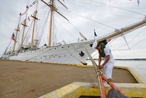 Leandro Maldonado, a crew member aboard the Chilean tall ship Esmeralda  trims a mooring hawser Wednesday after the vessel arrived in Port Charlottetown. Public tours of the vessel will be offered Thursday from 11 a.m. to 6 p.m.