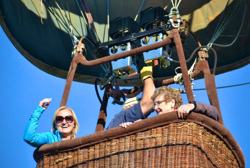 Theresa Kelly, right, lives out a lifelong dream of riding in a hot-air balloon thanks to her granddaughter, Tara Fulop, left, who took her on Thursday.