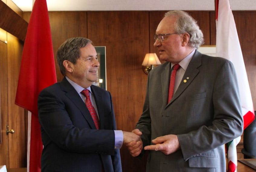 Premier Wade MacLauchlan, right, and Canada’s ambassador to the United States, David MacNaughton, discuss the future of trade relations with the U.S. and how it will impact P.E.I. 
