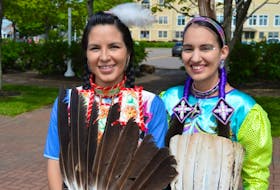 These two women did a lot of smiling on Wednesday. Countless tourists and locals asked for pictures of the women, Wyonna Bernard, left, and Jessica Smith, dressed in colourful Mi’kmaq regalia at the National Aboriginal Day at Confederation Landing Park in Charlottetown.