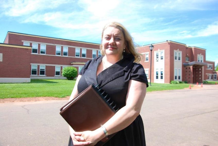 Dr. Heather Keizer, Prince Edward Island’s chief mental health and addictions officer, poses in front of Hillsborough Hospital in Charlottetown. The province is looking to replace the old building that opened in 1957.
