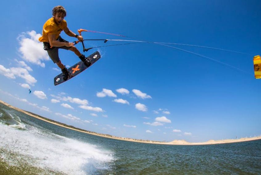 Lucas Arsenault catches air during a kiteboarding heat. He says every day, every ride, is a new experience.
