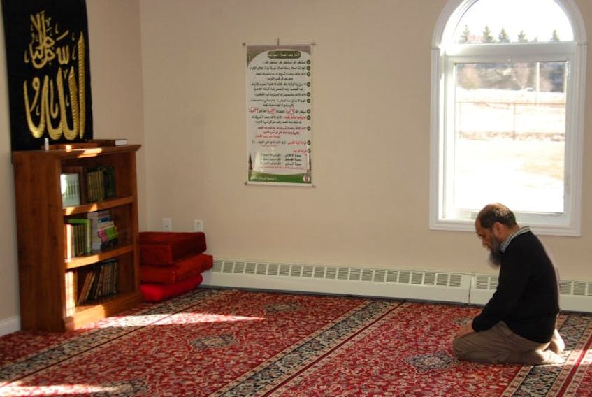 Rehan Babar of Stratford prays Monday afternoon at the Masjid Dar As-Salam mosque in Charlottetown. The mosque was the target of threatening actions and vandalism in 2011 and 2012. On Sunday, a gunman killed six men during evening prayers at a mosque in Quebec City.