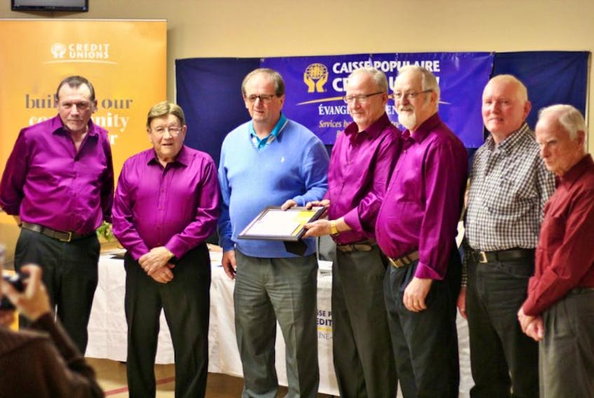 Billy  MacKendrick, Évangéline-Central Credit Union board member, third left, presents the 2016 Volunteer of the Year Award to the Helping Hands Band, from left, Ted Peters, Alton Silliker, Orville Rogers, Junior Boylan, Bill Mallett and Lorne Howard. Submitted photo