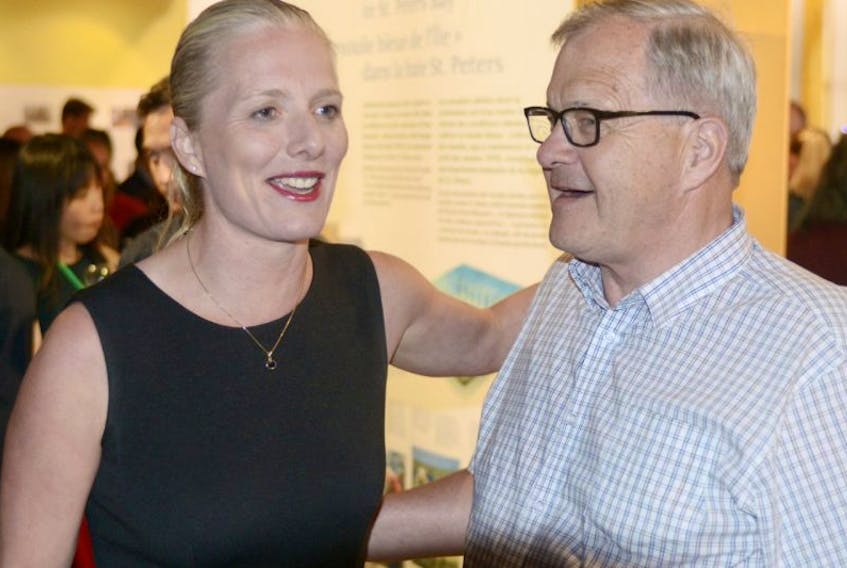 Federal environment minister Catherine McKenna chats with Cardigan MP Lawrence MacAulay during a reception for the Commission for Environment Cooperation at Greenwich Interpretation Centre Tuesday night. McKenna will lead a public session during the conference at UPEI Wednesday.