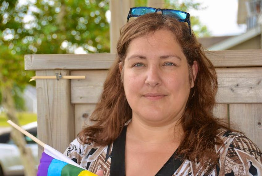 Catherine Arsenault, a Summerside resident, learned that her neighbour broke her pride flag last week. Since the incident, she decided to leave the broken pole where it was displayed as a symbol of a community that has been marginalized by hate speech. 