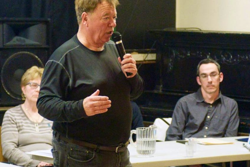 Murray Harbour chairman Garry Herring speaks to a crowd assembled Feb. 15 to hear details of the community's finances.