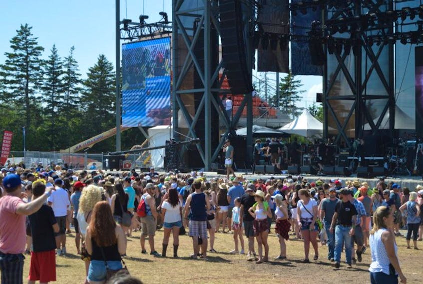 The crowd gets ready for a performance Sunday at the Cavendish Beach Music Festival. 