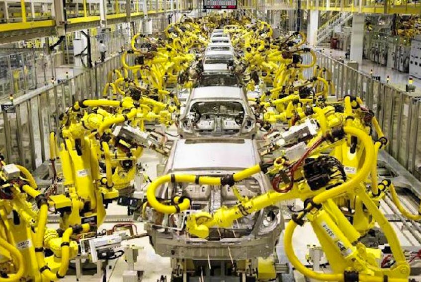 A typical auto manufacturing production floor will have thousands of industrial robots lined up doing multiple tasks.