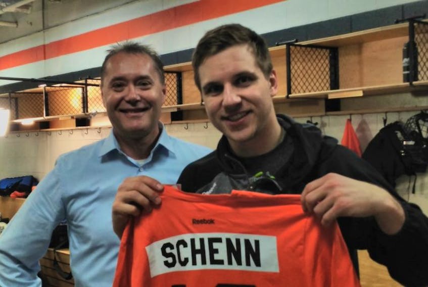Charlottetown native Hulio Rethy, left, of Karen Phytoplankton poses for a photo with Brayden Schenn of the NHL's Philadelphia Flyers. Schenn is a company spokesperson for the company, which is based in Sackville, N.B.