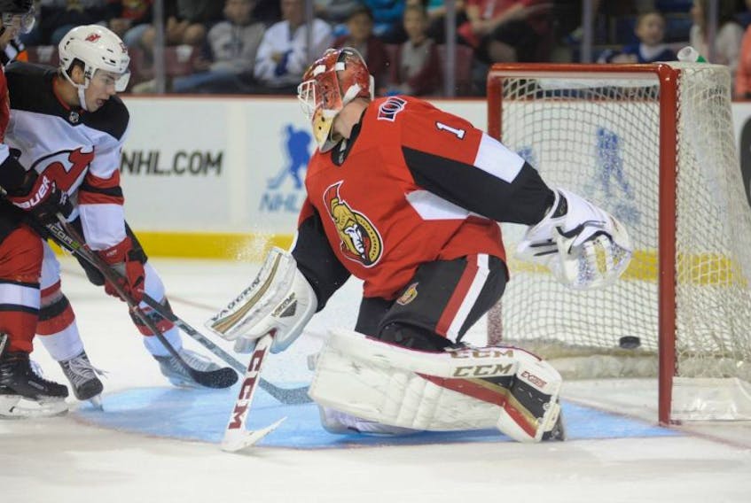 New Jersey Devil's Nico Hischier scores on Ottawa Senator's goaltender Mike Condon during first period NHL exhibition action at Credit Union Place in Summerside on Monday.