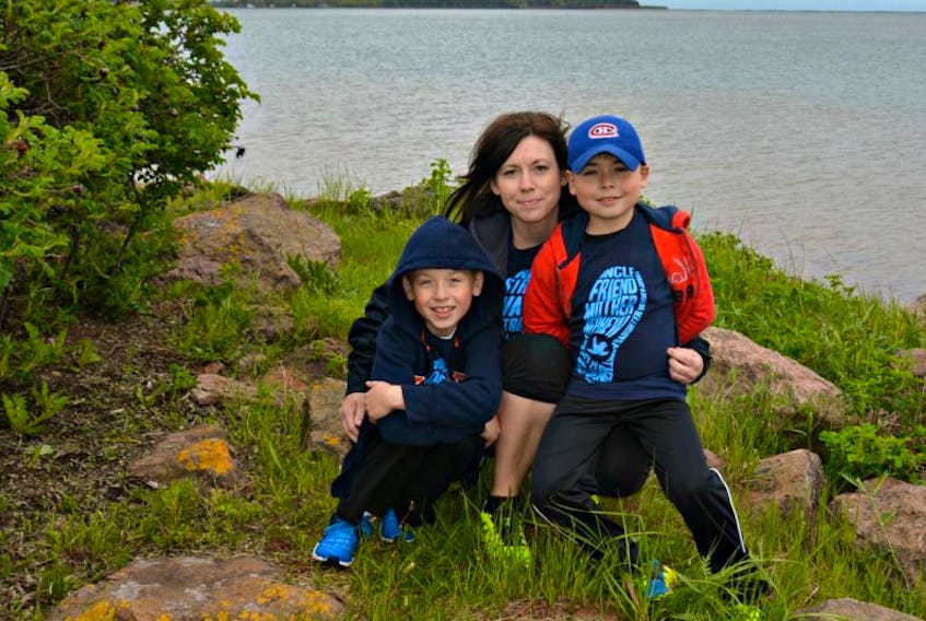 Mary Anne O’Halloran is shown with her two sons, Logan MacDonald, 7, and Jacob, 9. Both children have juvenile idiopathic arthritis (JIA), a non-hereditary, autoimmune disease. 
