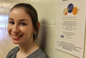Rachel Adams stands next to the Days for Girls poster she made promoting her community event at the Borden-Carleton Public Library. Participants came together on May 13 to cut fabric that will be used to make sustainable feminine hygiene products that will be sent to Kenya. 