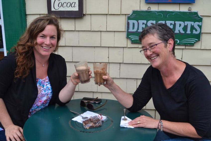 Peggy Sue Payne, left, of Nanimo, B.C., and her aunt Michelle Payne enjoy drinks on the deck of Island Chocolates in Victoria-by-the-Sea. It’s become a tradition for Peggy Sue to visit Victoria with her aunt each summer. They enjoy visiting the various shops and cafes.