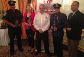 From left, Charlottetown Police Services Const. Tim Keizer, RCMP Const. Kim Dudley, Crime Stoppers president Don Reid, Summerside Police Services Const. Johnathan Kennedy and RCMP Const. Steve Duggan.
