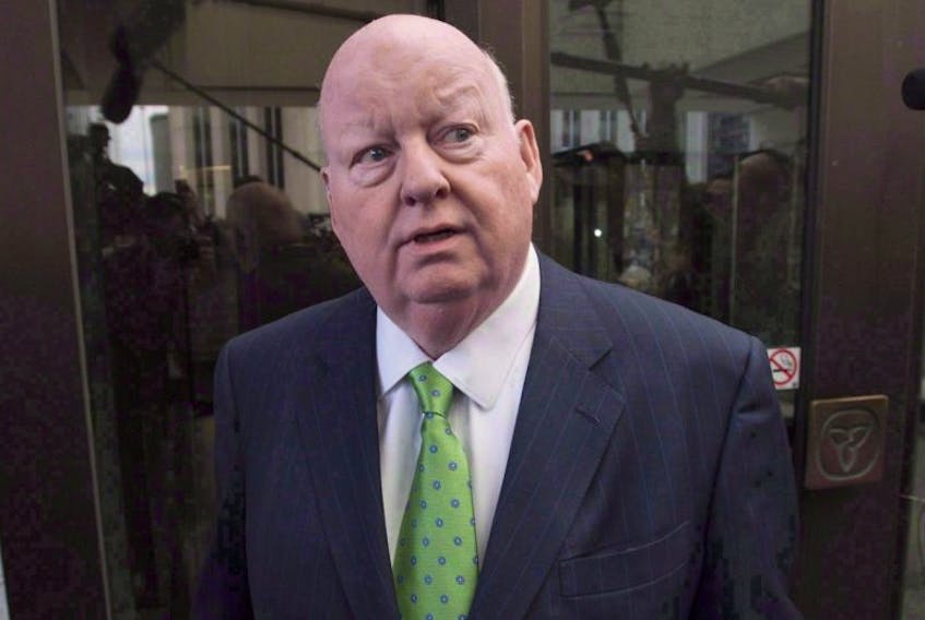 Sen. Mike Duffy leaves the courthouse after being acquitted on all charges Thursday, April 21, 2016 in Ottawa. Duffy is suing the Senate and the RCMP for the way they handled accusations about his expenses 