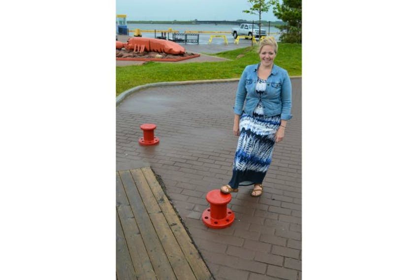 Corryn Clemence, business development manager for Port Charlottetown, shows concrete barriers that block vehicle traffic from accessing a part of the port. More of these are being put in place leading up to Canada Day festivities.
