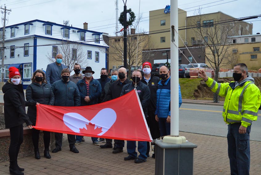 A small group comprised mostly of CBRM councillors gathered at the flag poles outside the civic centre in Sydney to acknowledge the internationally recognized Giving Tuesday. Among those attending were United Way of Cape Breton executive director Lynne McCarron, far left, and councillor Steve Gillespie, third from the right, who read the CBRM proclamation in recognition of Giving Tuesday. DAVID JALA • CAPE BRETON POST