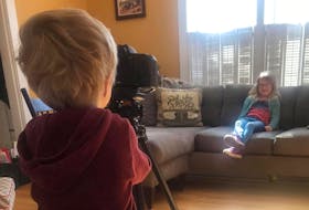 Oliver Perry, 4, films his sister Mae, 6, for a short film they made with their father called The Covid Kids. The two siblings starred in the film, which was posted online on April 1.