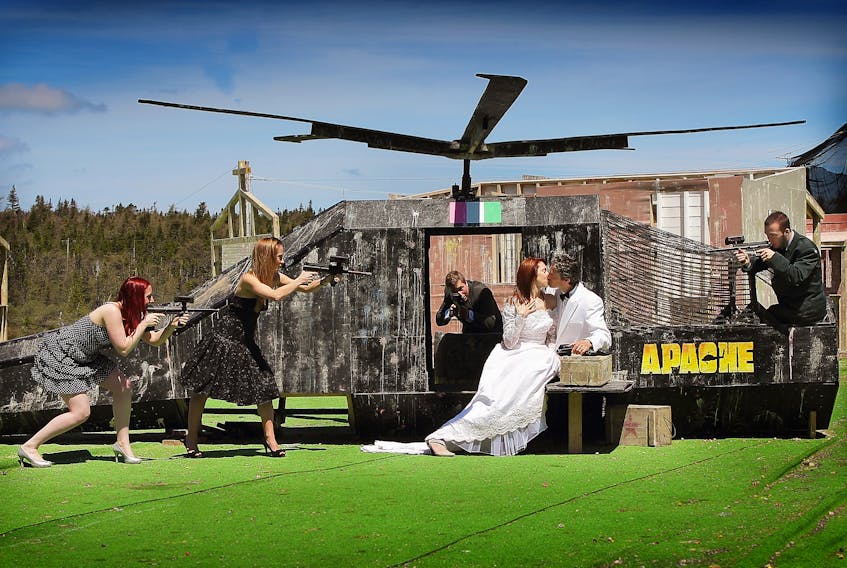 Frontline Action co-owners Tom Davis, in the tuxedo, and his wife, Bev Moore-Davis, are "held captive" near a helicopter mockup during a game of laser tag by their daughter, Jessica Moriarity, and others in happier times. With the pandemic, anyone playing at the St. John's entertainment facility has to ensure they are socially distanced or wear a face mask.

