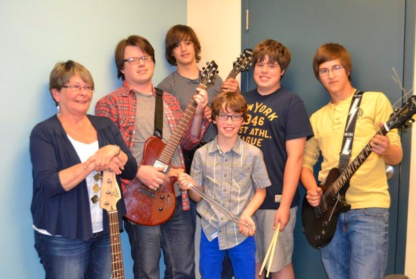 Members of The Rock are excited about their next gig at Trinity United Church in Charlottetown on June 14 at 7:30 p.m. From left are Karen Burhoe, Rev. Keith Gale, Kody MacKay, Tristan Ohl and Nate VanIderstine. In the front is Alec Higginbotham. Missing from photo are Shelby MacLeod and Andraia Gregory. Other young people who have performed in the band, over the years, include Curtis Dicks, Abby MacLeod, Molly Gillis-Robertson, Andrew MacFarlane, Chaucer Fraser, Brandon Cann, Ethan MacKay and Hailey Ferguson.