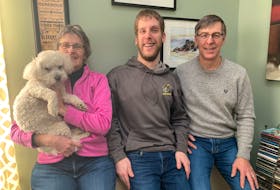 The Deveaux family, from left, Gina with dog Bruin, Curtis and Stephen. CONTRIBUTED