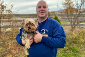George Della Valle on the family farm with his dog Connor. CONTRIBUTED