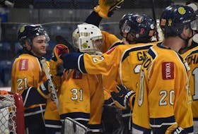The Yarmouth Mariners congratulate their goalie Justin Sumarah on his 4-0 shutout over Pictou in the team's final regular season game. TINA COMEAU PHOTO
