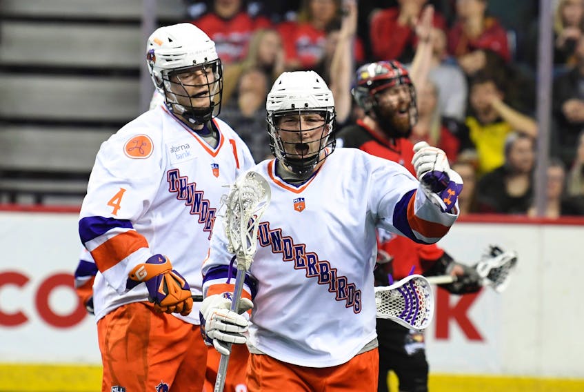Halifax forward Ryan Benesch celebrates one of his two goals scored in the second half while defenceman Graeme Hossack looks on during the Thunderbirds' 15-12 comeback victory over the Calgary Roughnecks at the Scotiabank Saddledome on Saturday night. 
CANDICE WARD / Calgary Roughnecks