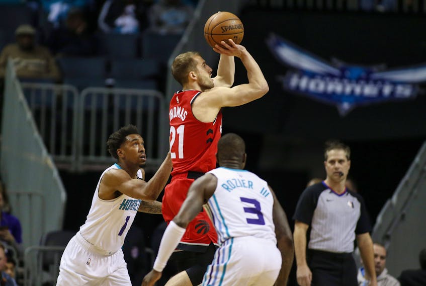 Raps’ Matt Thomas unloads a jumper against the Hornets in Charlotte, N.C., back in January. Though he was sidelined for more than a month with an injury, Raptors’ rookie guard, Thomas has been exceptional from beyond the arc, shooting 51.5%. (AP FILES)