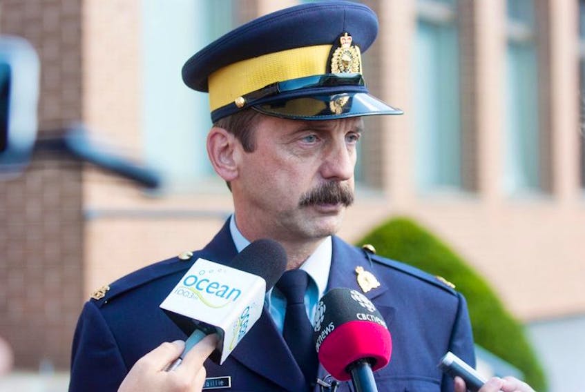 <span>Staff Sergeant Kevin Baillie of the RCMP speaks to reporters Wednesday at police headquarters in Charlottetown Wednesday. All schools across Prince Edward Island were evcuated after RCMP received a threat. Later in the day, after a full threat assessment, RCMP issued a statemwnt saying they found the threat was not credible. The investigation continues.</span>