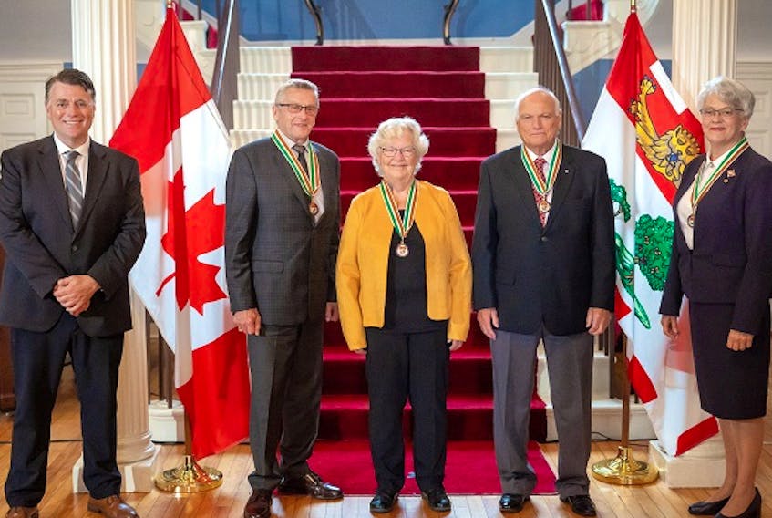 P.E.I. Premier Dennis King, left, and Lt.-Gov. Antoinette Perry, right, congratulate 2020 Order of P.E.I. recipients, from left, Bev Simpson, Olive Bryanton and Henry Purdy.