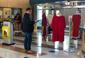 Jude Gerrard, Mi'kmaq and Indigenous advisor at Nova Scotia Community College took part in a Red Dress Dedication ceremony for missing and murdered indigenous women at the Pictou Campus on Oct. 28. Gerrard did a smudging as part of the event. ADAM MACINNIS