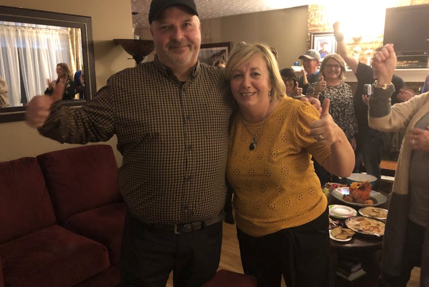 Darren O'Quinn celebrates winning the District 11 seat with his wife Nancy and supporters gathered at this house in New Waterford on Saturday evening.