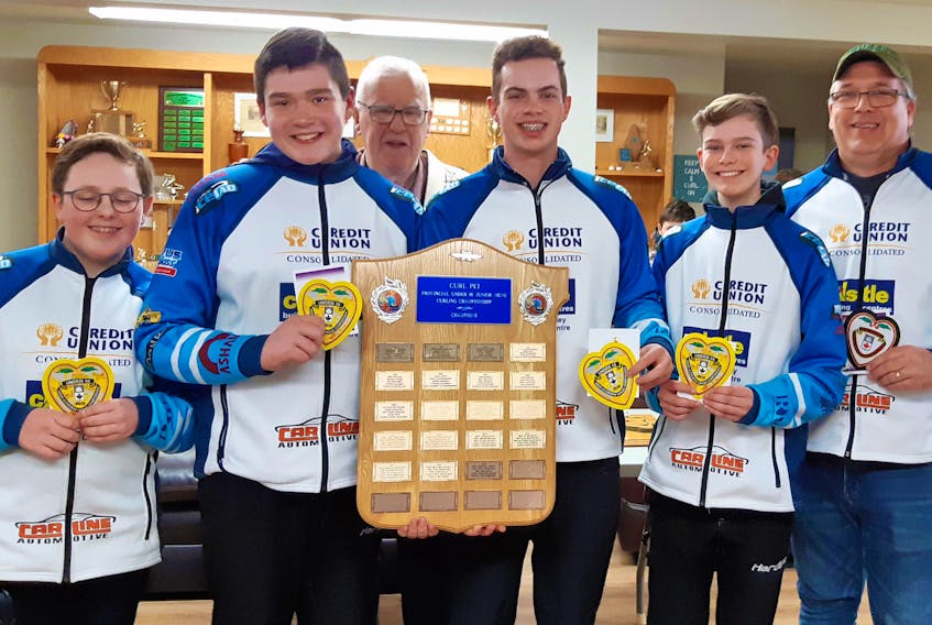 The Brayden Snow-skipped rink from the Charlottetown Curling Club recently won the P.E.I. under-18 boys curling championship at the Western Community Curling Club in Alberton. Host club president Fr. Art Pendergast, back, congratulates team members, from left: Snow, third stone Jack MacFadyen, second stone Liam Barbrick, lead Davis Nicholson and coach David MacFadyen.