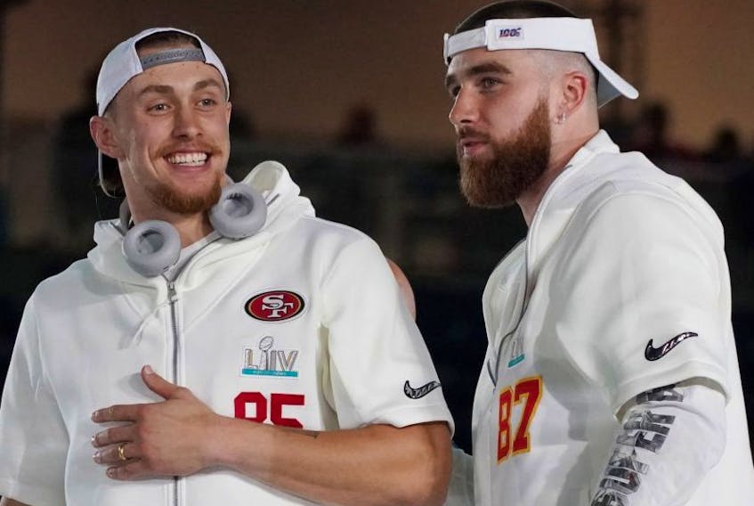 San Francisco 49ers tight end George Kittle (left) greets Kansas City Chiefs tight end Travis Kelce during Super Bowl LIV Opening Night at Marlins Park on Monday. USA TIDAY