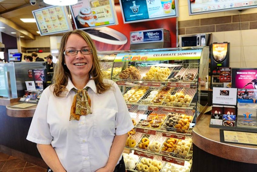 <span>Corinne Preston, district manager for Tim Hortons in Charlottetown, is preparing for the introduction of energy-saving LED lighting in Island stores. Guardian photo by Nigel Armstrong</span>