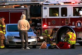 FOR FILE:
Halifax regional firefighters tend to a pedestrian, that was struck by a car near the Mumford bus terminal in Halifax March 3, 2021.