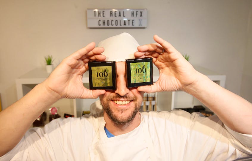 Stanislas Mozoluk of Chocolate Hackers, poses samplings of their 100% no-sugar dark chocolate in their Robie Street shop Friday, June 28, 2019.