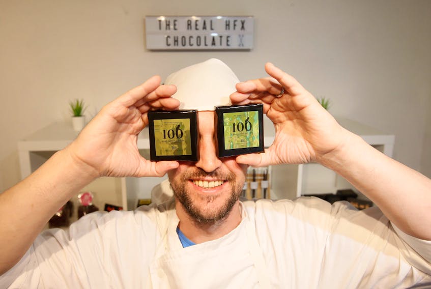 Stanislas Mozoluk of Chocolate Hackers, poses samplings of their 100% no-sugar dark chocolate in their Robie Street shop Friday, June 28, 2019.