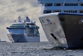 The cruise ship, Serenade of the Seas, left, arrives behind the already arrived, Insignia, in Halifax Wednesday, Sept. 18, 2019.